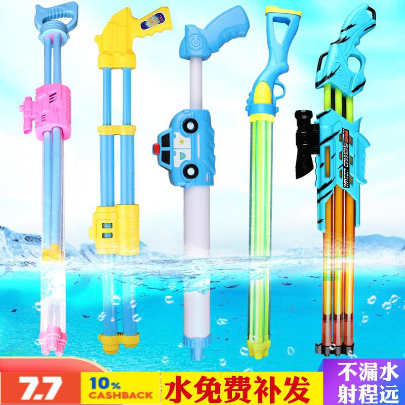 toy pistols Boy s toy water gun on the beach Water gun blue summer