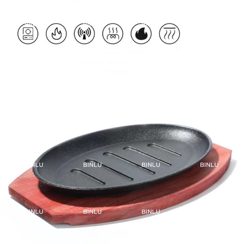 Oval sizzling plate with wood base and handle sizzling plate with