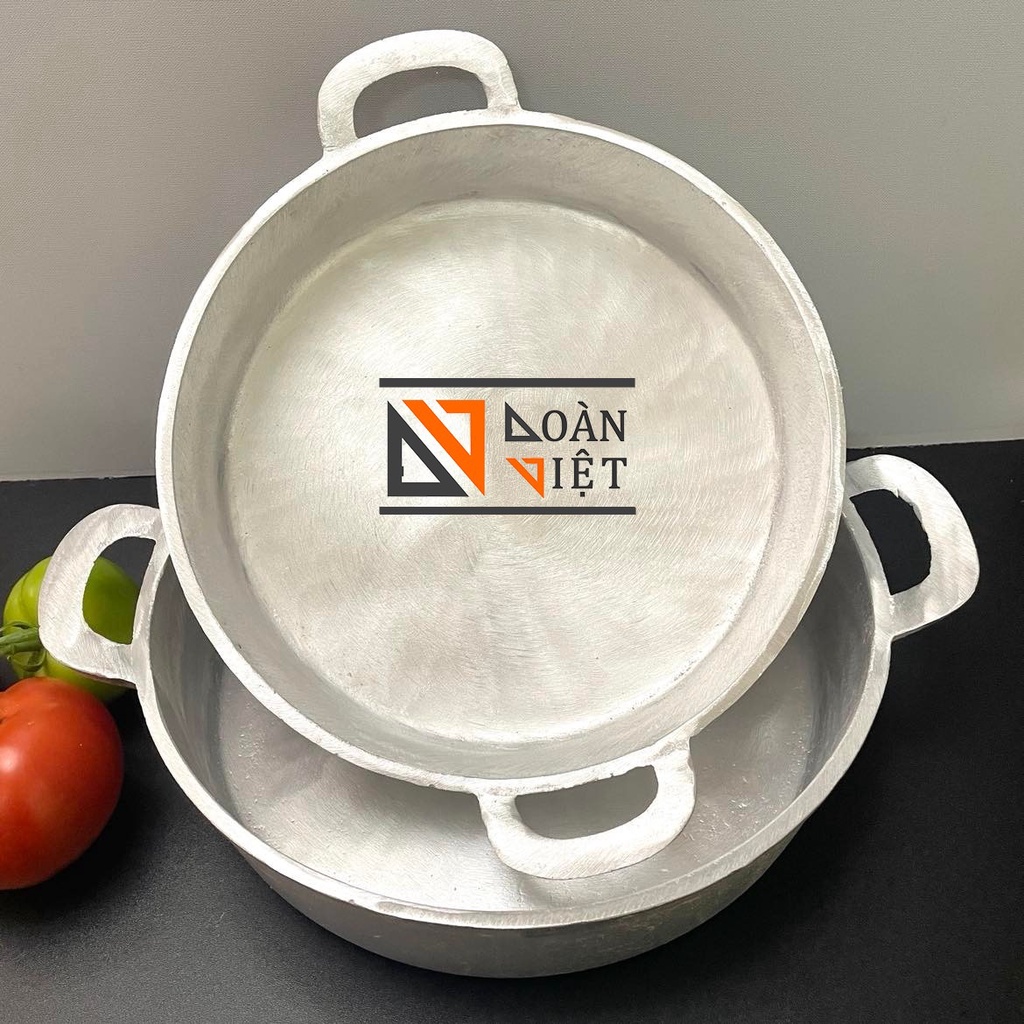 Solid cast iron pan with flat bottom Used to stirfry vegetables
