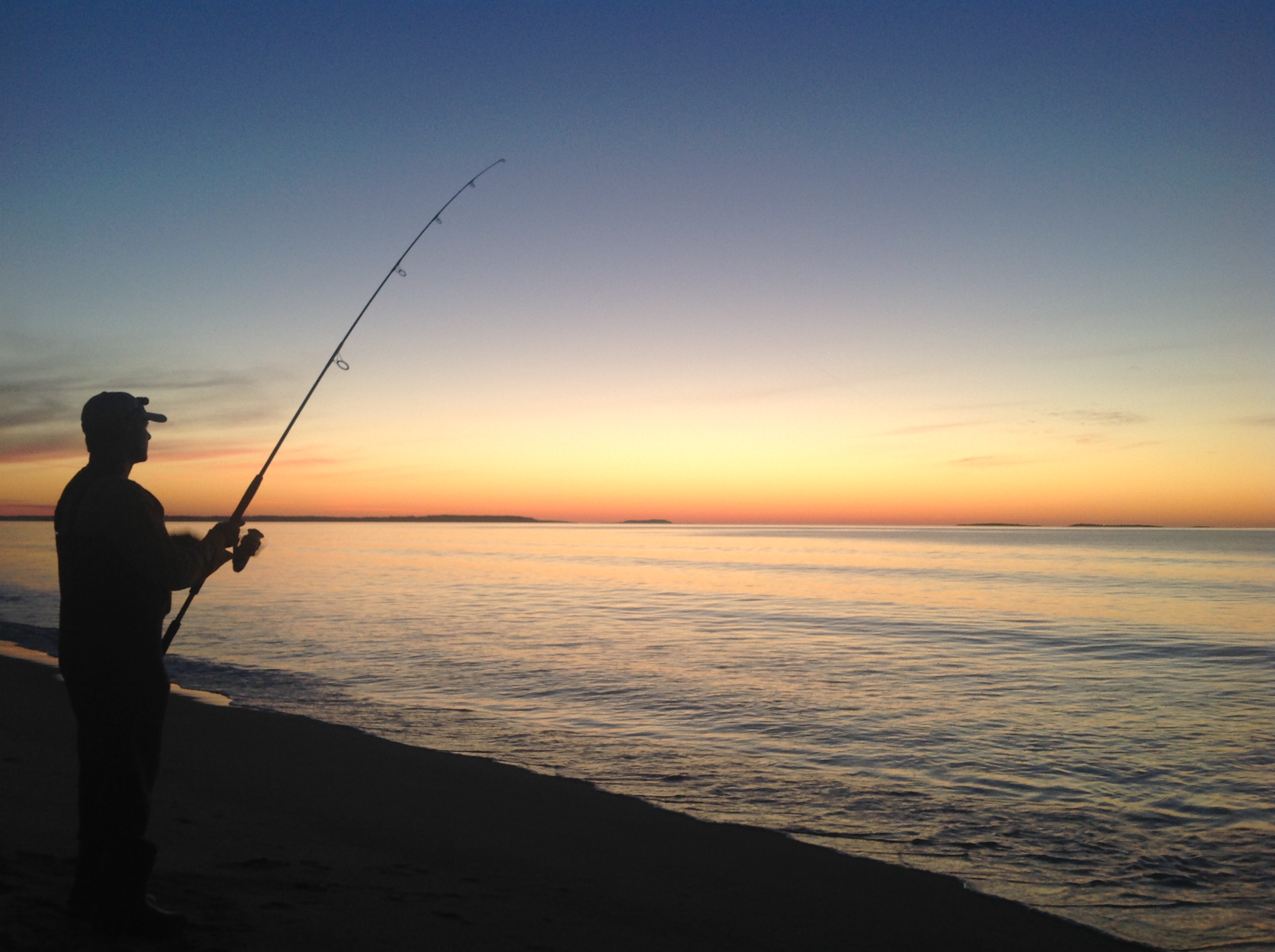 Fishing at sunrise at old orchard beach Down East