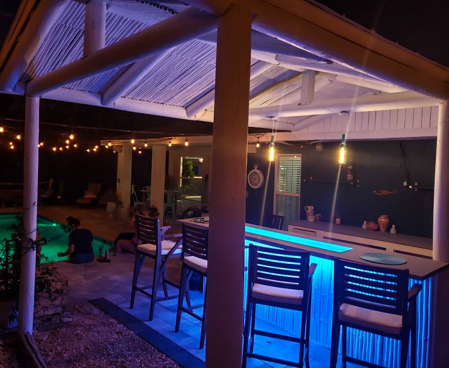 Tropical Outdoor Kitchen and Bar with Glass Countertops Downing Designs