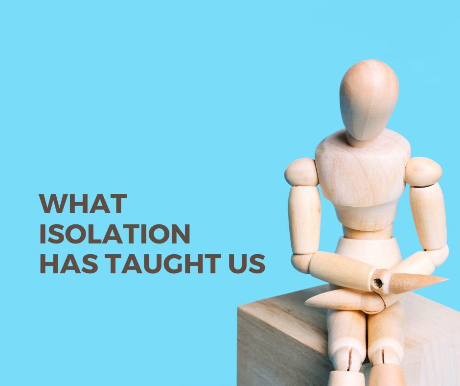 Wooden human figure sitting alone on a box on sky blue background