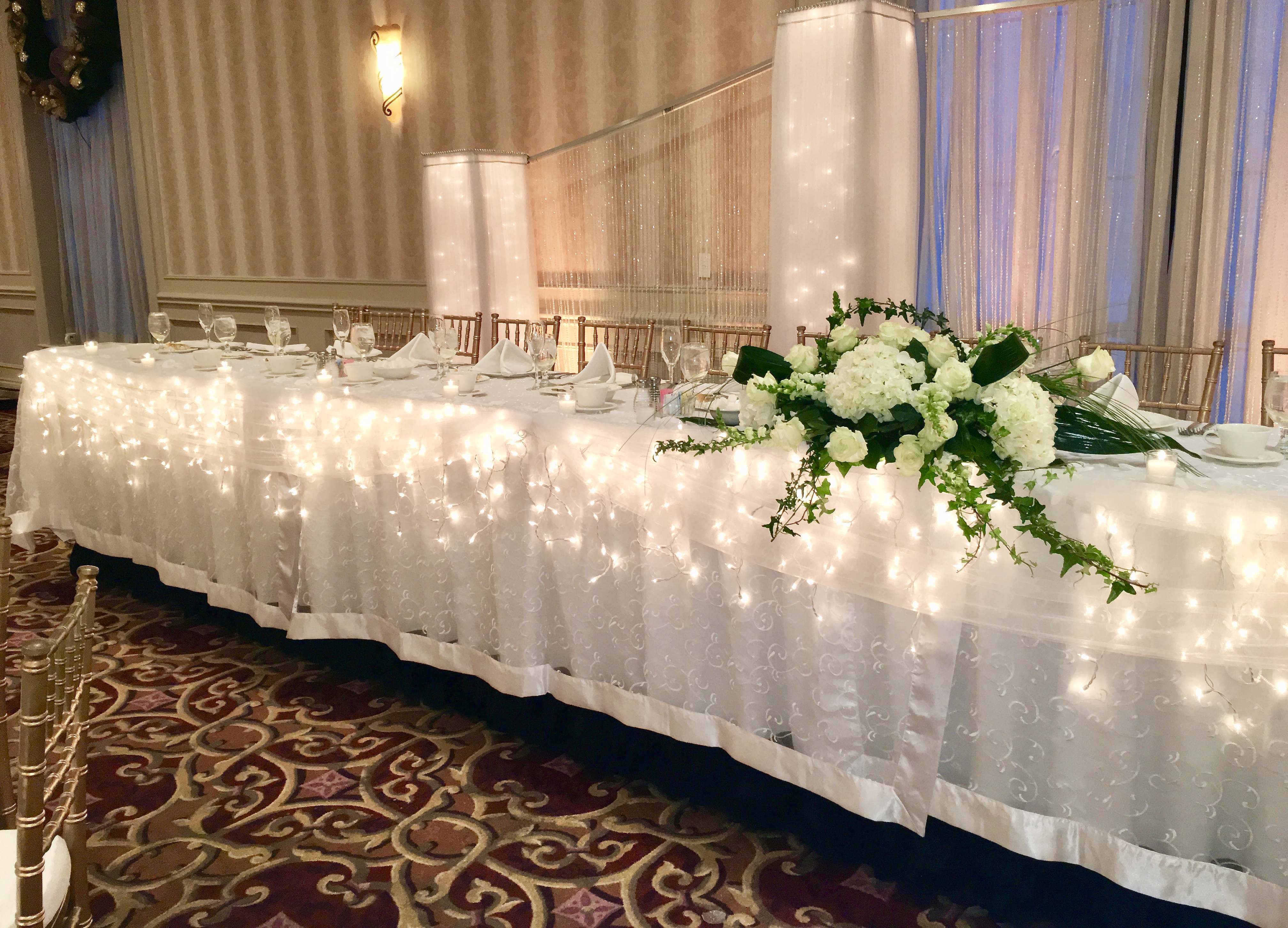 DreamsLighted columns, pillars,decorating head table
