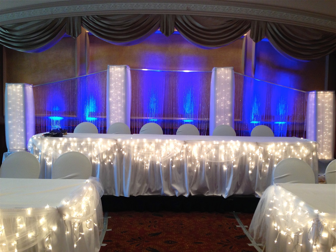DreamsLighted columns, pillars,decorating head table