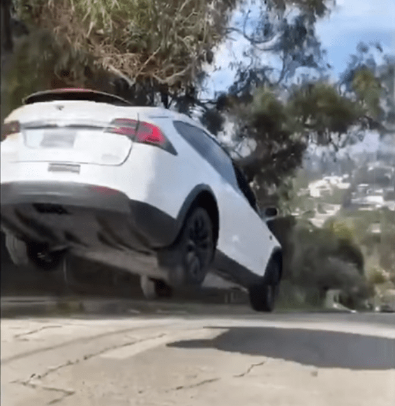 Watch a Tesla Model X take flight on a city street Drive Tesla