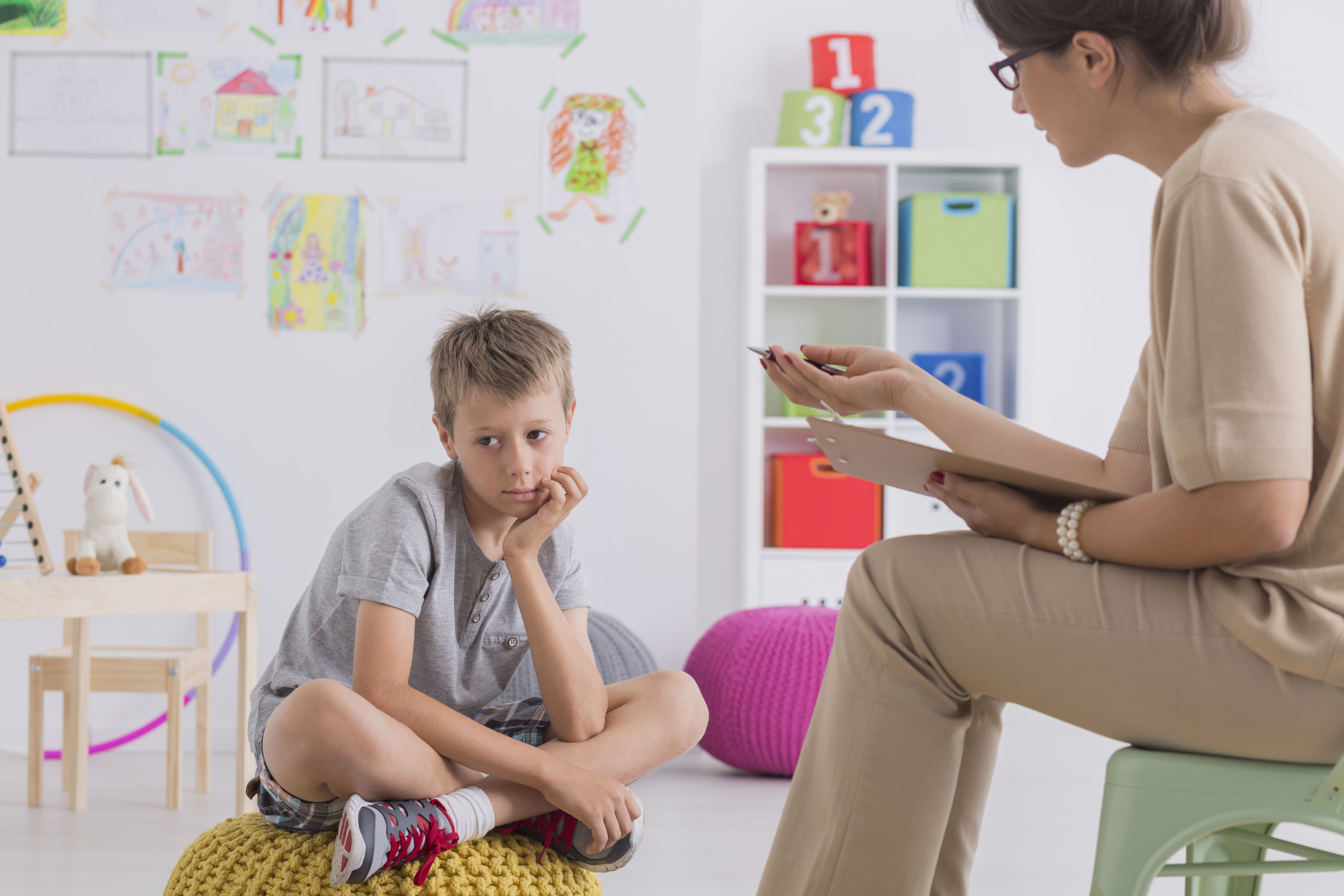 Child having conversation with psychotherapist Dr. Jonice b