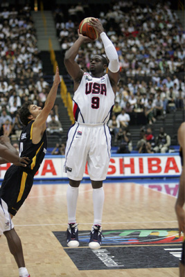 Dwyane Wade shoots over defender