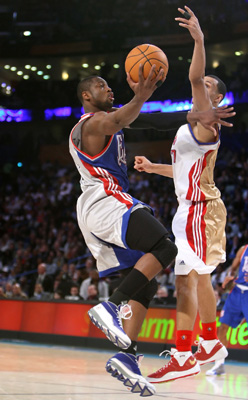 Dwyane Wade holds off a defender