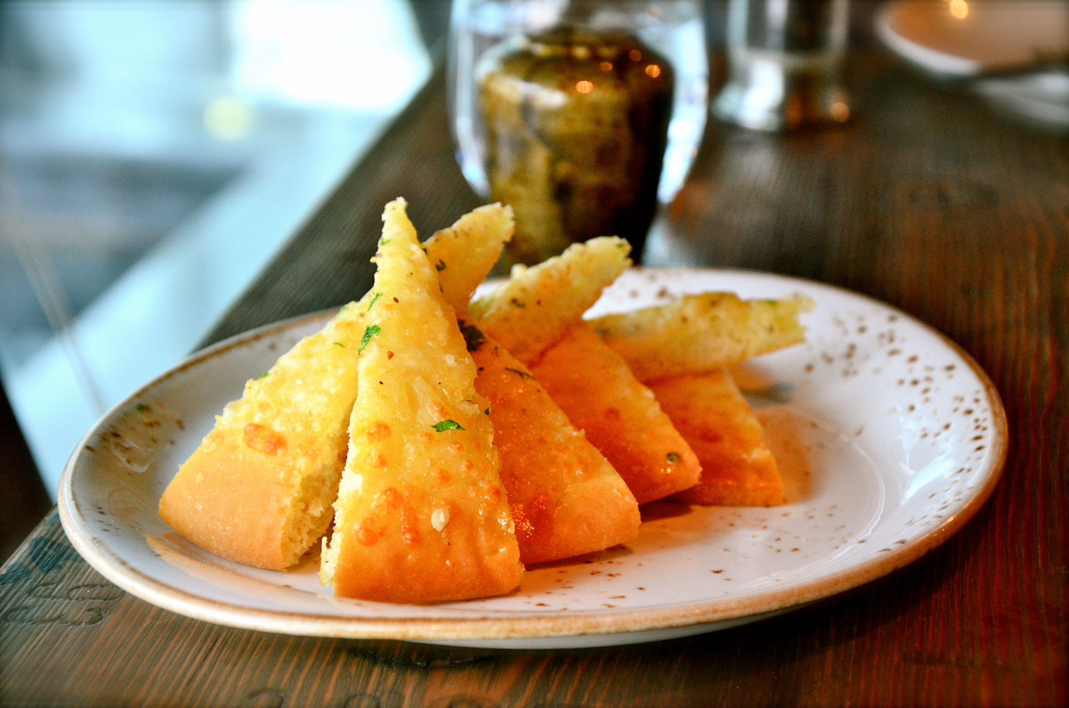 Cheesy Garlic Bread baked flat bread topped with garlic & mozzarella cheese