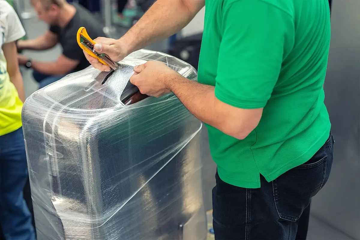 The Real Reason Why Some People Wrap Luggage in Plastic