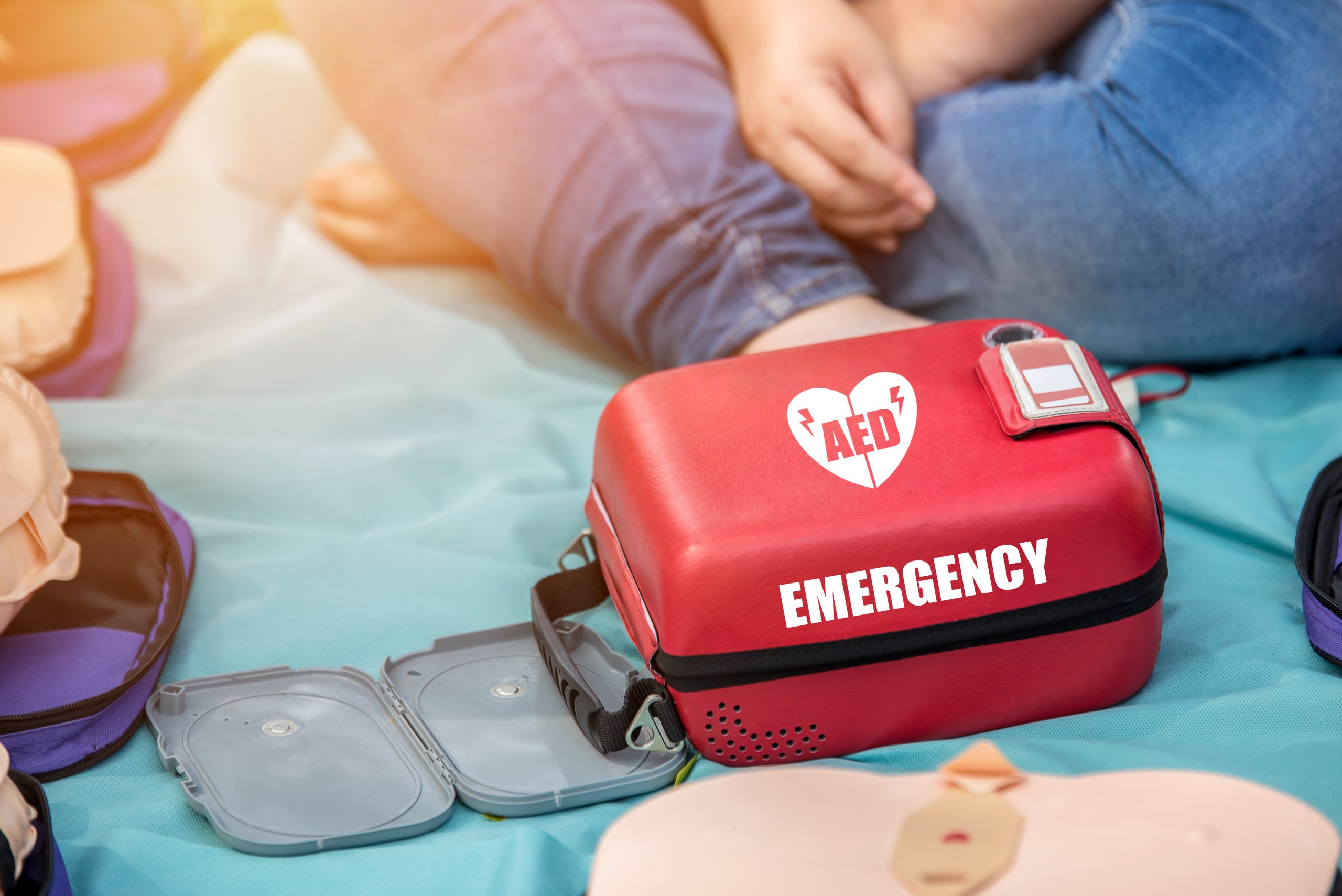 Automated External Defibrillator (AED) Box on the Mat in Emergency CPR Training Course First