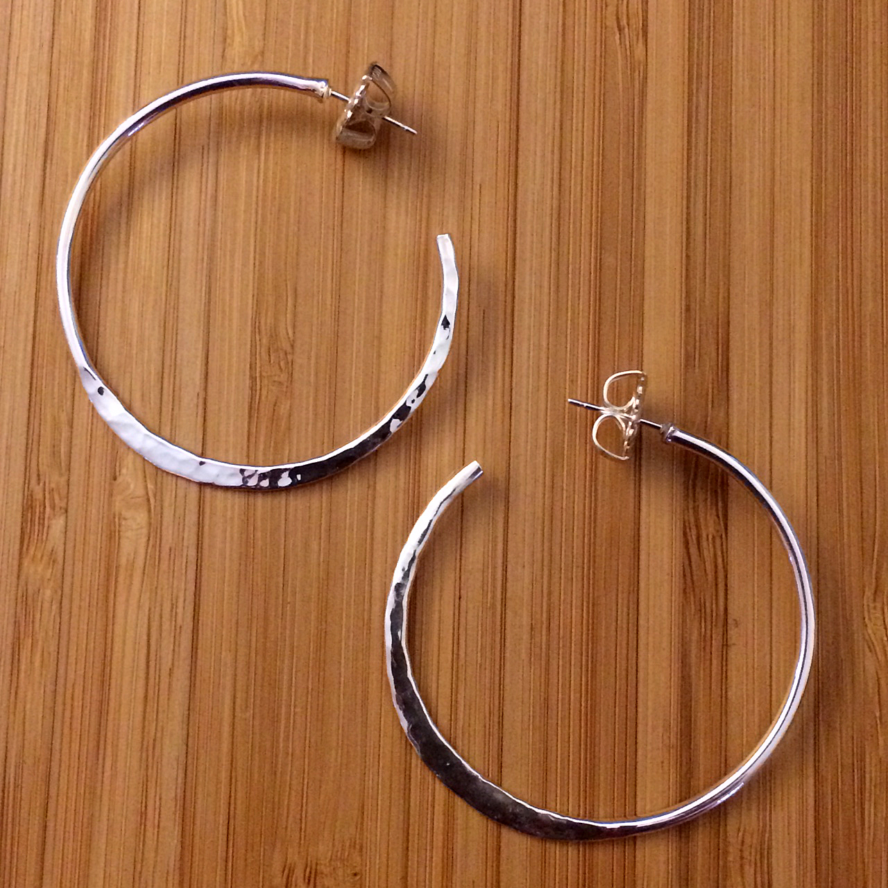 half hammered sterling silver hoops earrings
