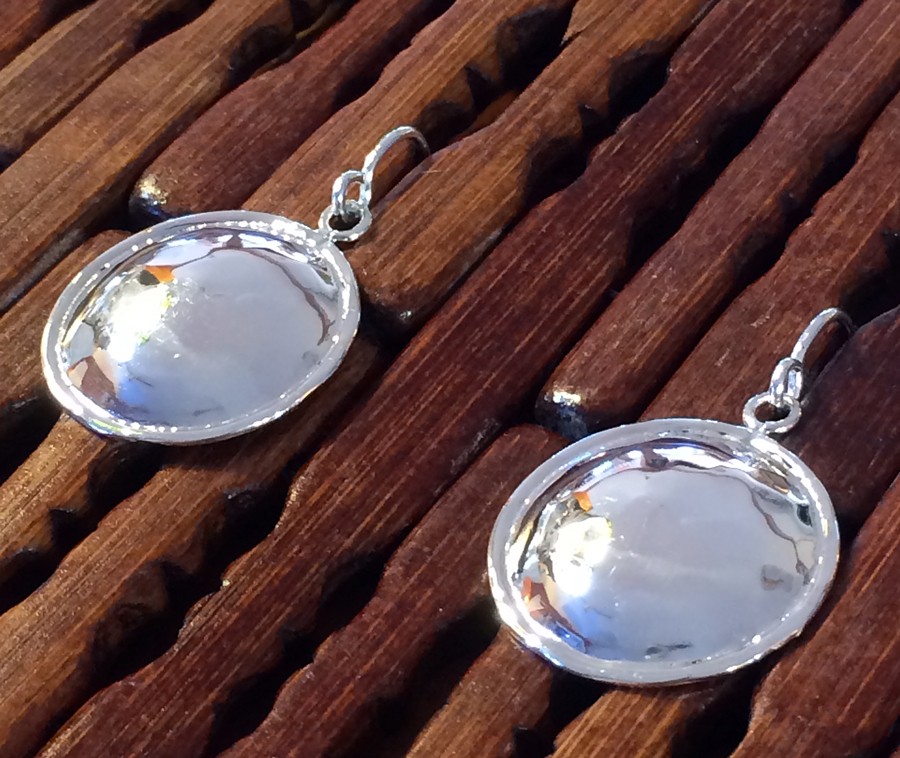 These sterling hammered earrings look like a home made piecrust, on