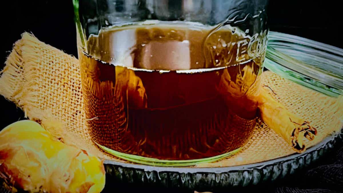 Spiced ginger syrup stored in a jar.