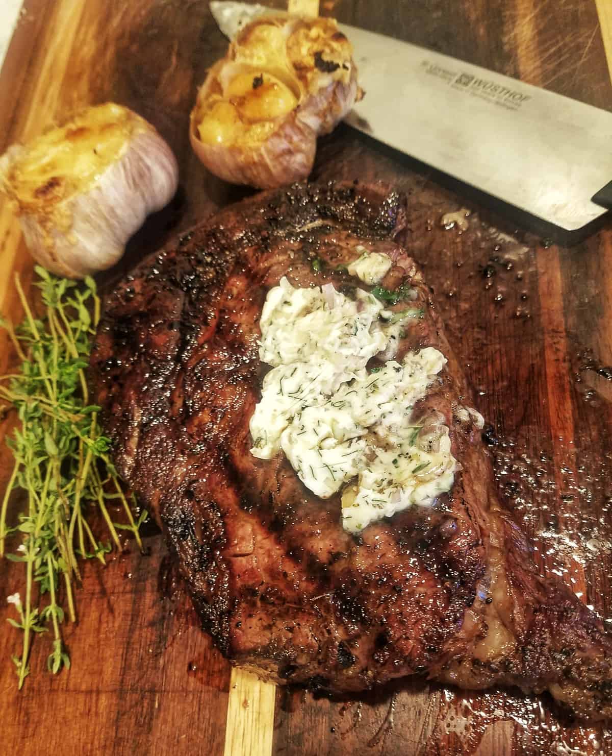 Sunday Dinner Grilled Ribeye Steak with Herbed Garlic Butter