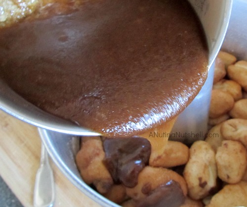 pouring sauce on top of dough balls