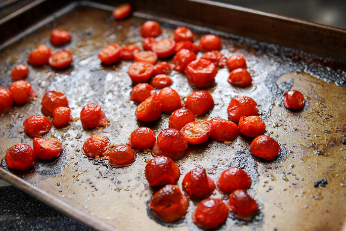 roasted tomatoes on baking sheet
