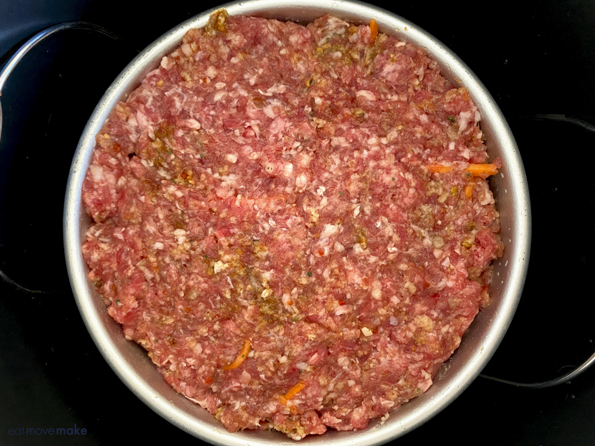 meatloaf mixture in pan inside multicooker