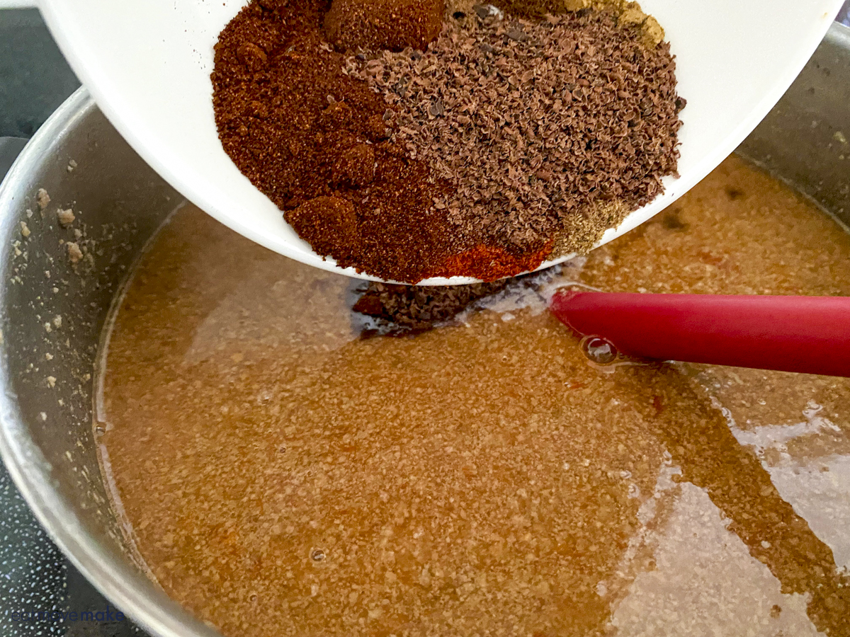 adding spices for cincinnati chili