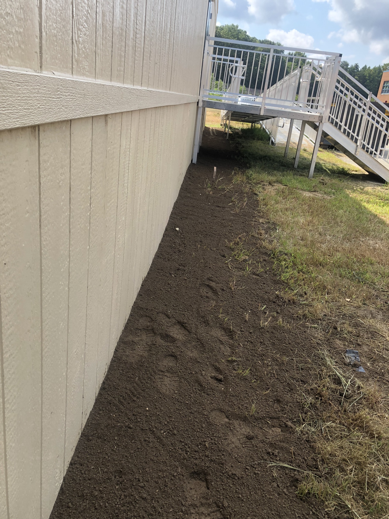 Modular building foundation, grading and seed. Waldorf, MD. Evans