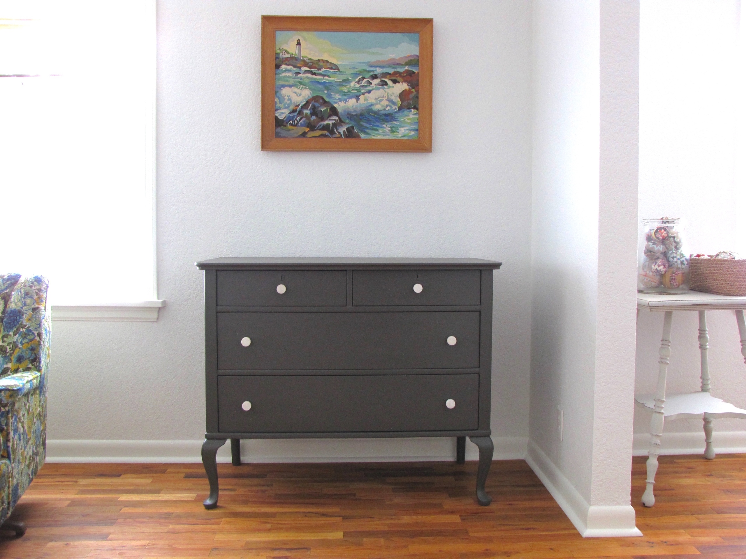 gray dresser with marble knobs