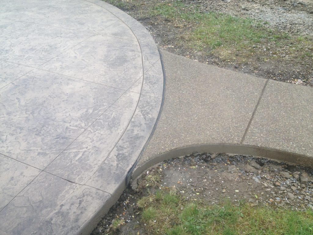 Stamped Concrete patio with Exposed Aggregate Concrete Driveways