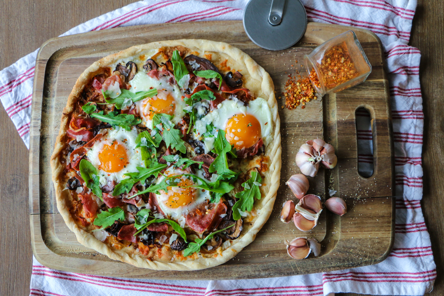 Breakfast Pizza with Prosciutto, Caramelized Onions, Mushrooms