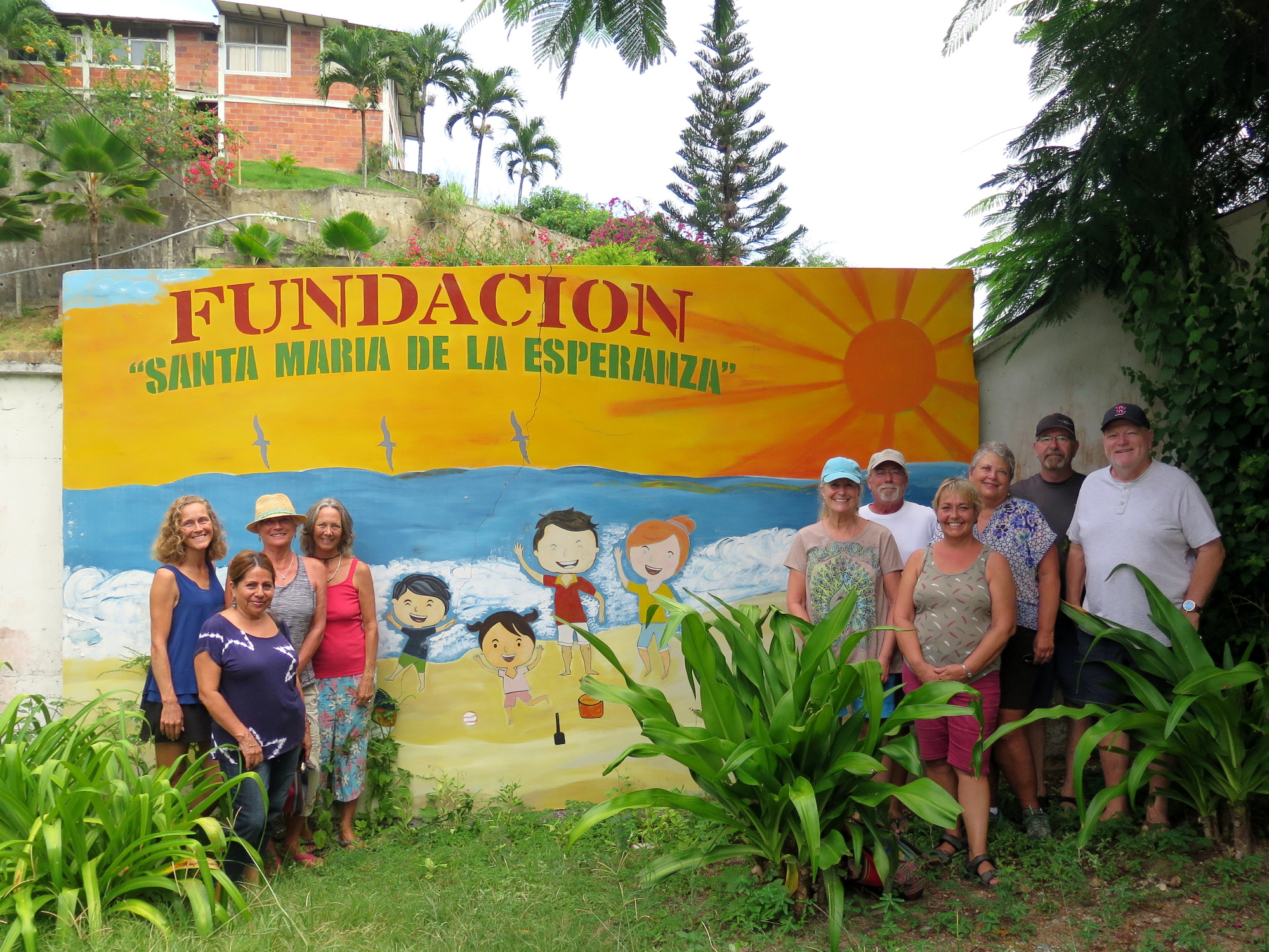 FOSMO board of directors in front of the orphanage