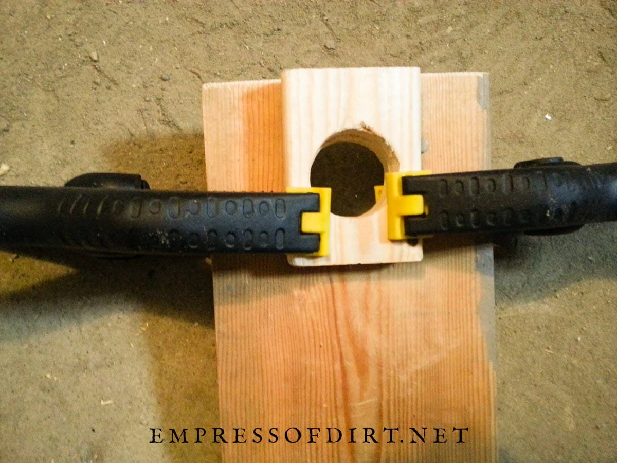 Attaching predator block to nesting box.