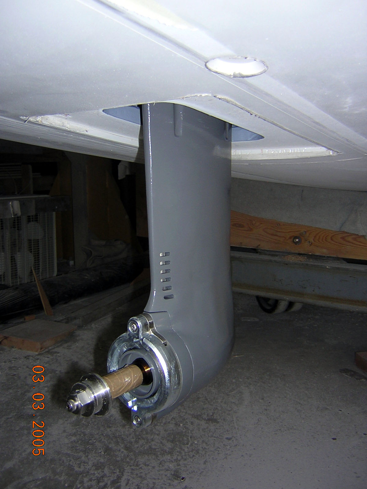 On the left, Tony gets the motor and saildrive properly lined up, and