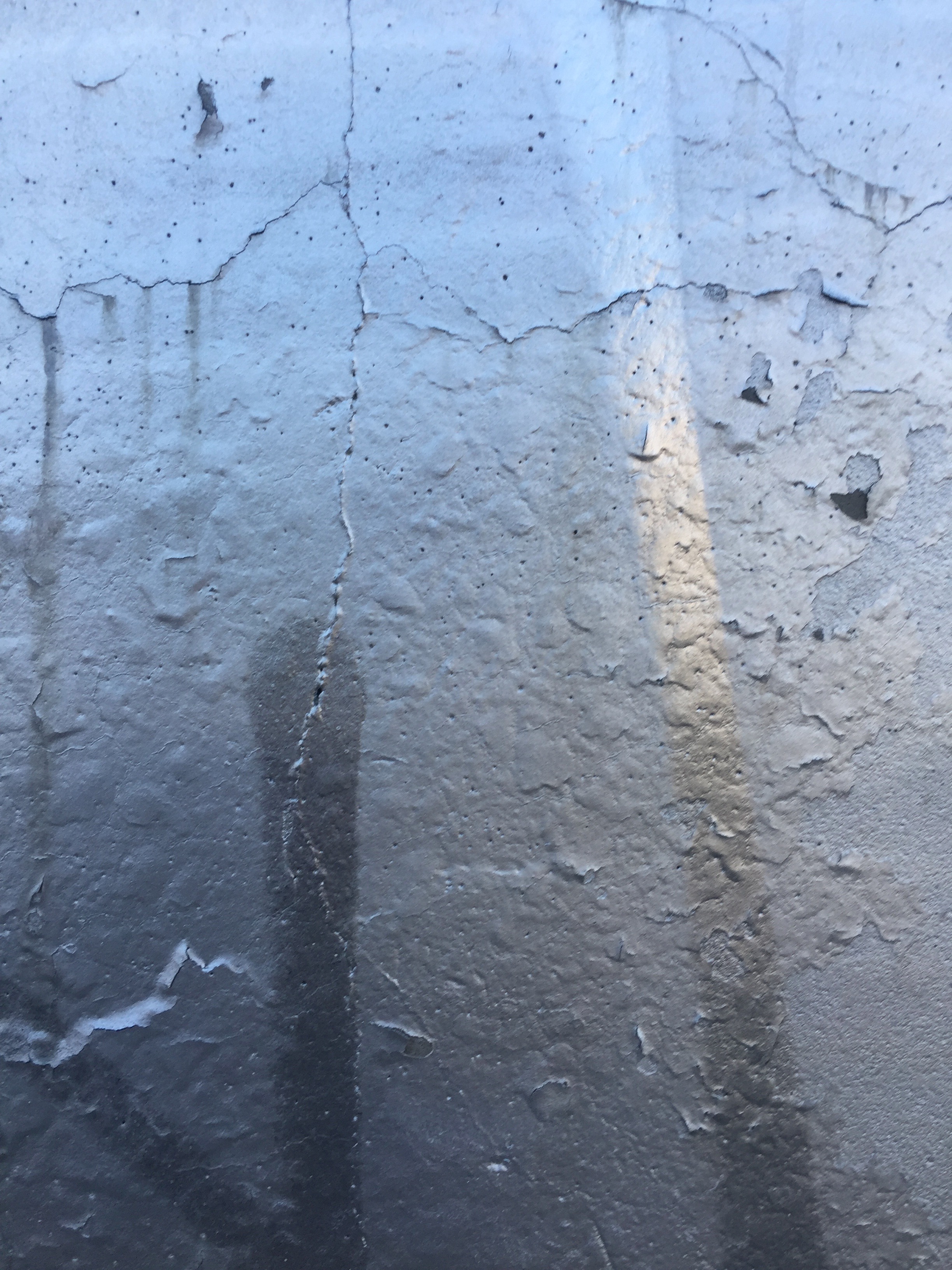 Grungy wall covered in black paint and spray paint Free Textures