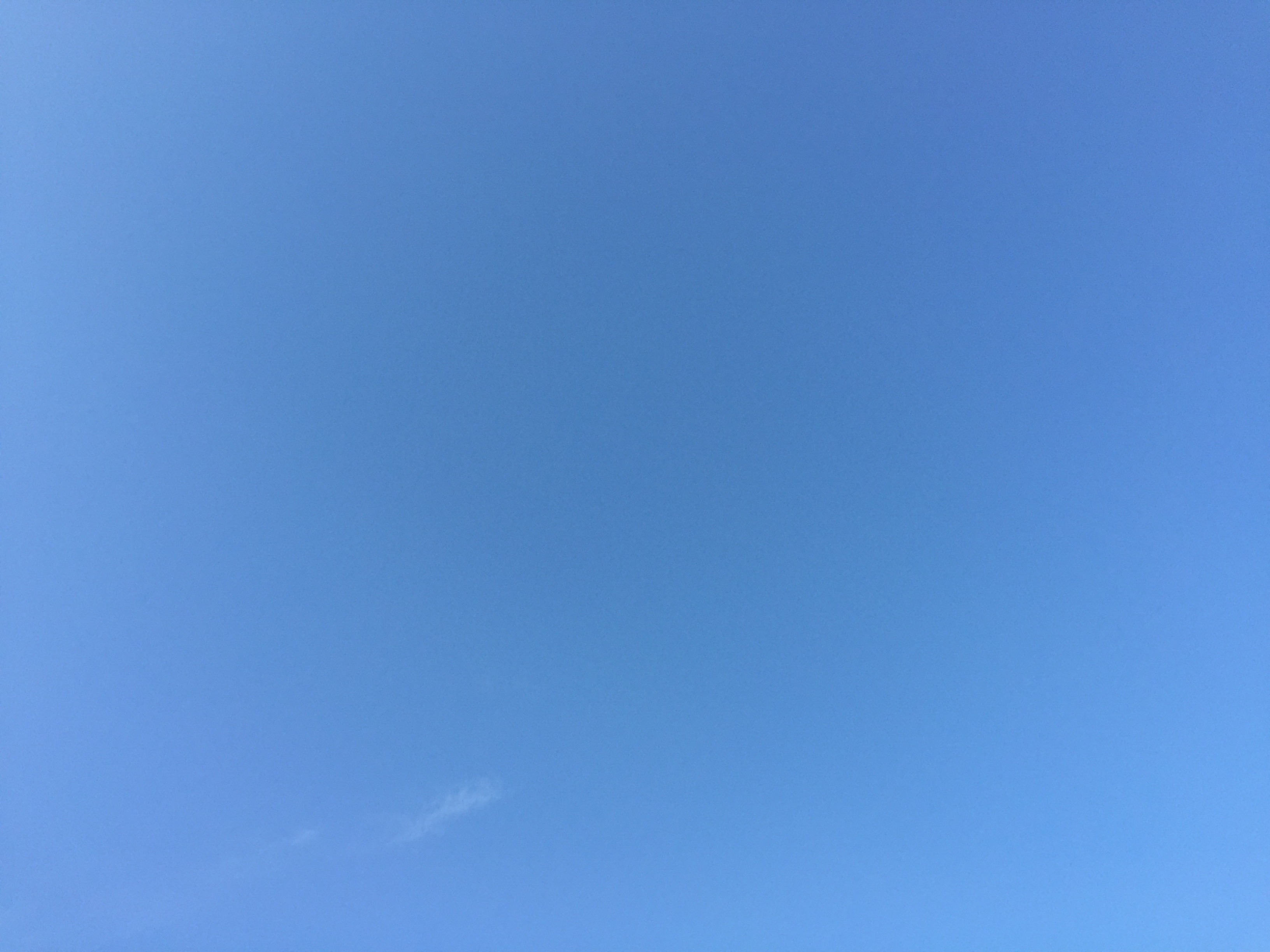 Blue sky with grain and one faint cloud Free Textures
