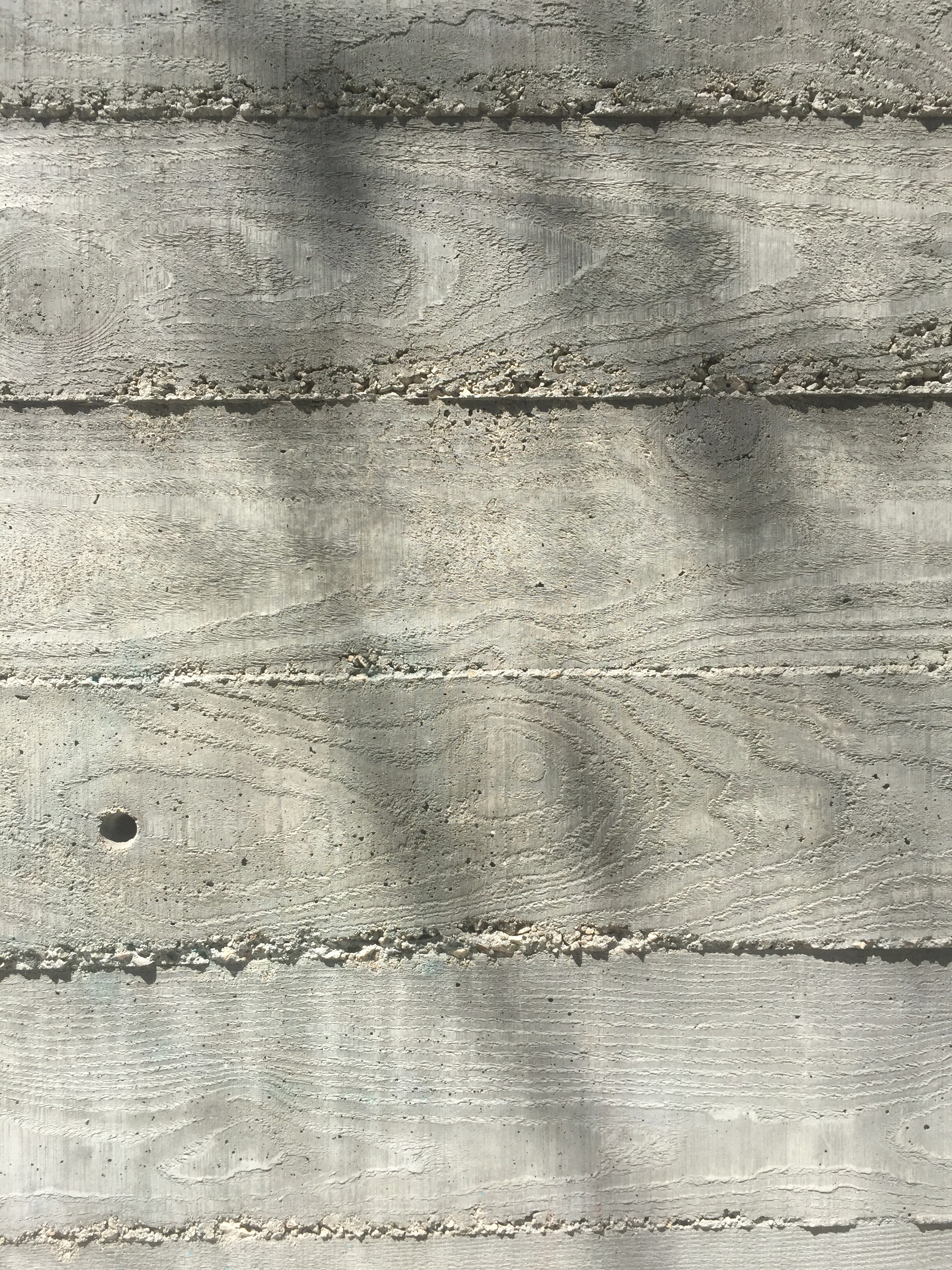 Wood grain imprinted on cement wall Free Textures