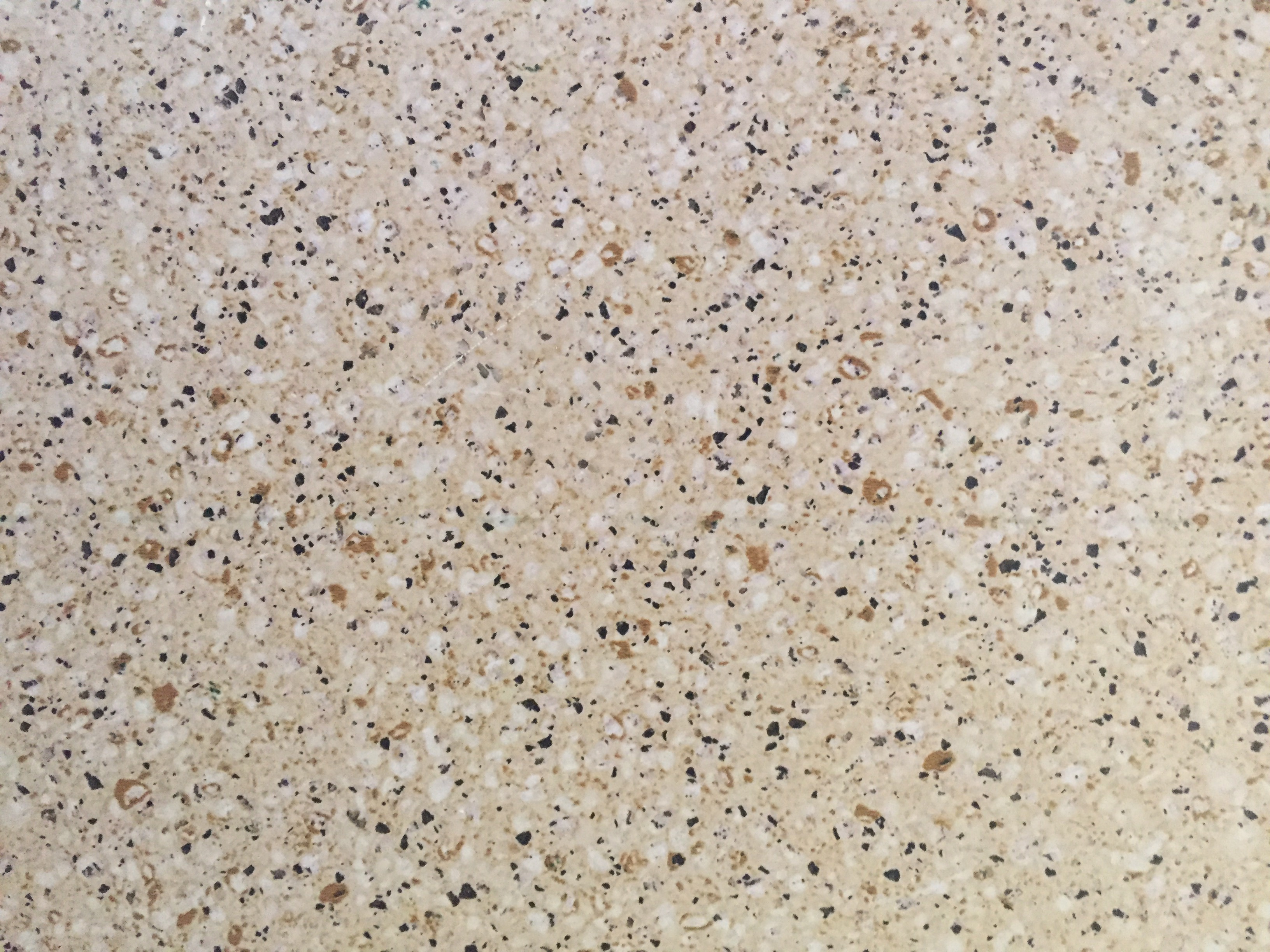 Granite with tan base and speckled irregular colored spots Free Textures