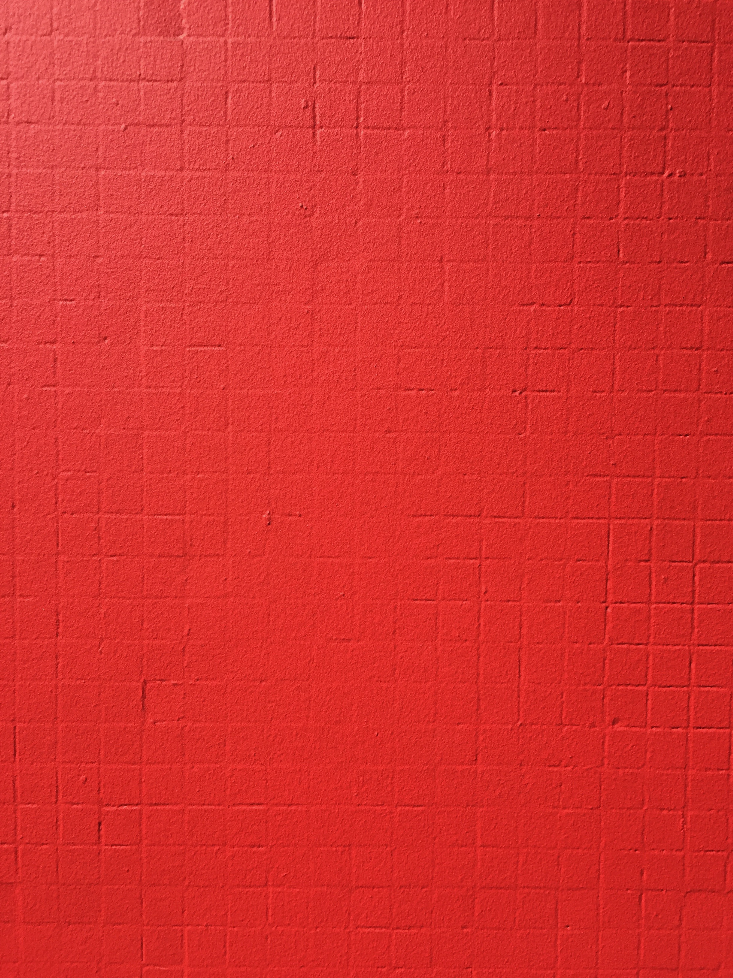 Very bright red paint on cement wall with square grid Free Textures