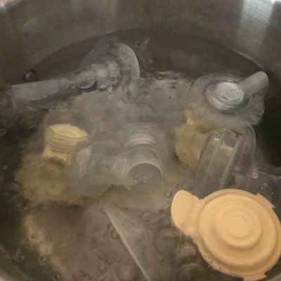 sanitizing bottles on stove