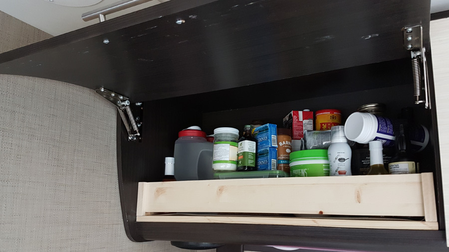 Securing stuff in the cupboards of our Thor Gemini 23tr Explorking