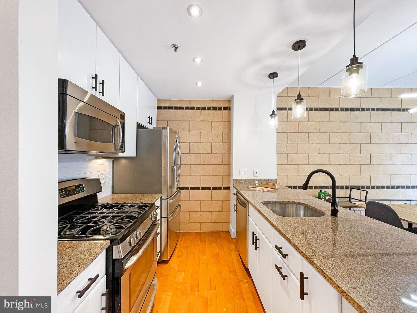 Exposed Brick DC One Bedroom + Den Condo on 14th Street 599,999