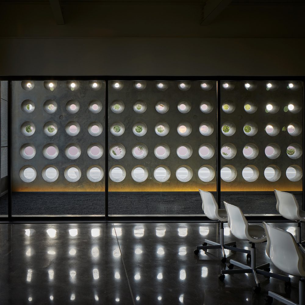 This concrete screen wall was inspired by the proportions of camera