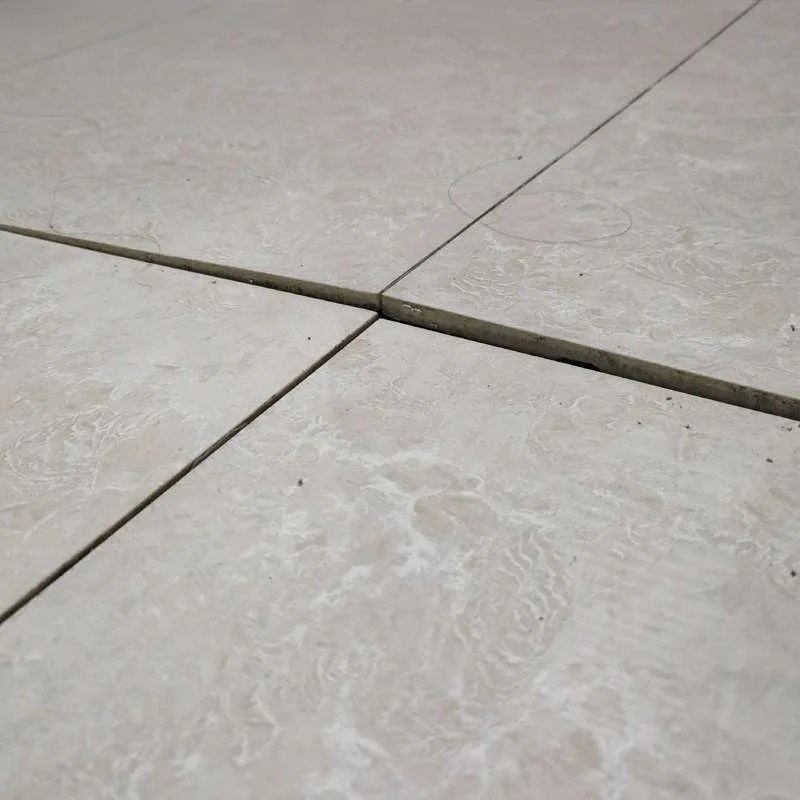 Loose ceramic tiles, falling off, hollow floor tiles, arched edges