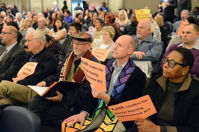 Faith leaders listen as Fresno Mayor Lee Brand presents his Rental