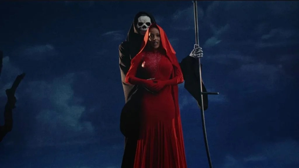 Doja Cat in her red attire in Paint The Town Red music video.