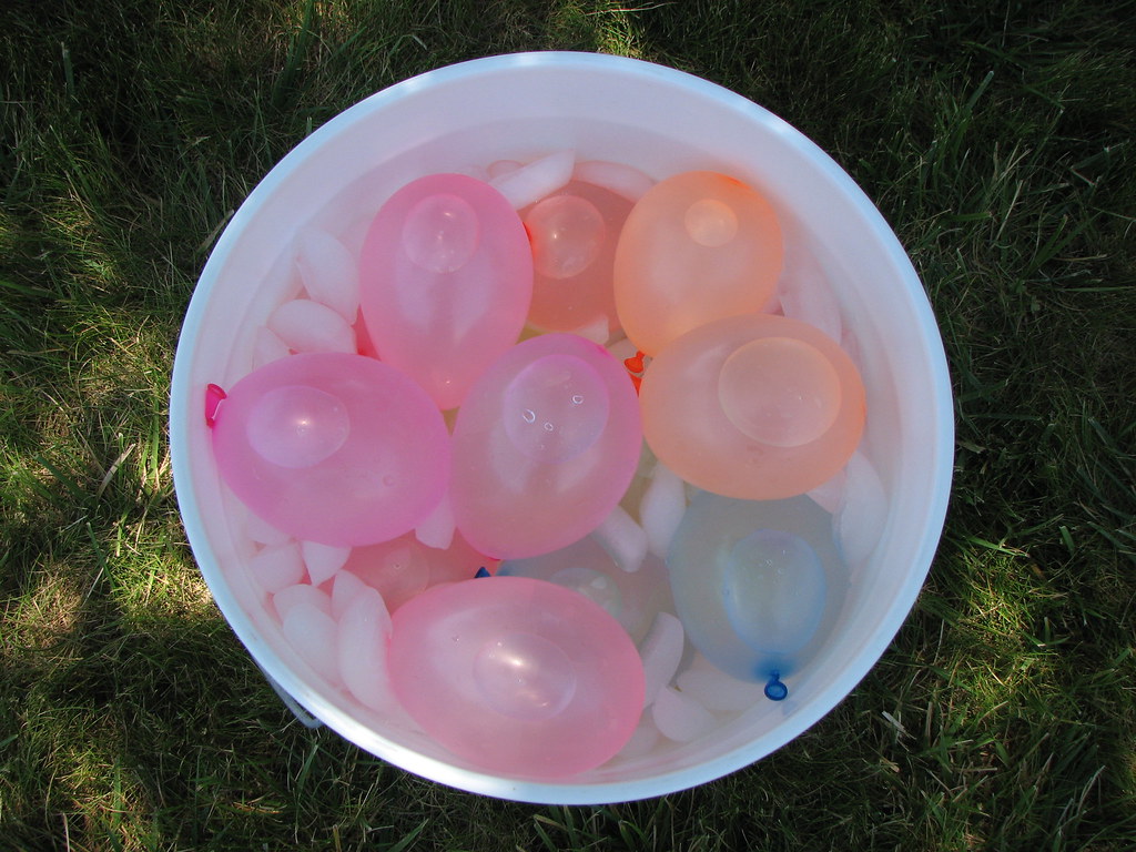 Bucket of water balloons in ice water Ready for throwing. … Flickr