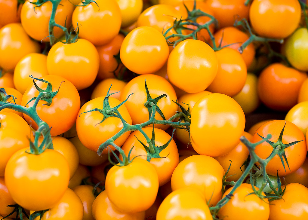 Tiny Tomatoes Tiny orange tomatoes for sale at the Dane Co… Flickr