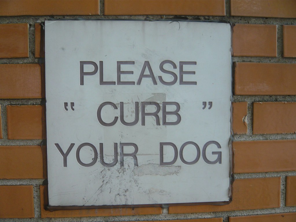 Please “ curb ” your dog This sign is attached to a Very I… Flickr
