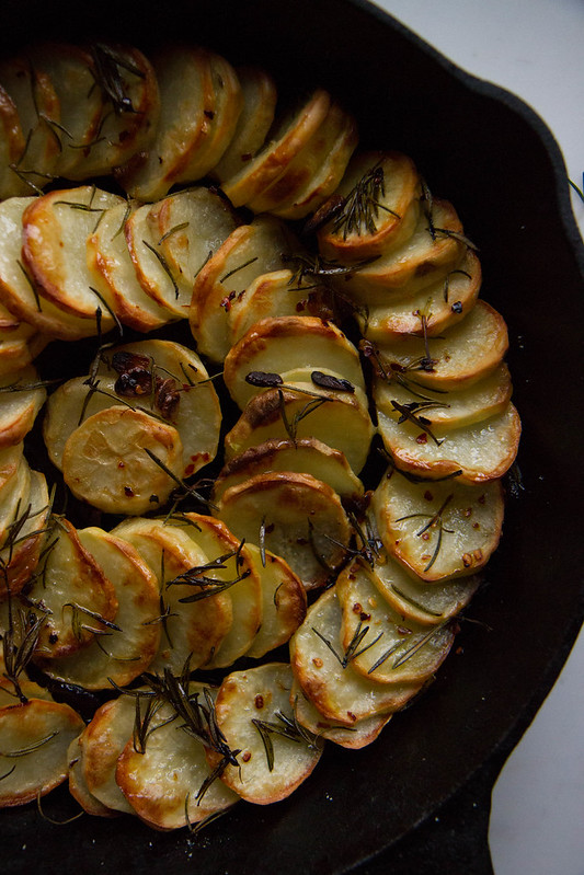 Skillet Baked Potatoes with Chili Garlic and Rosemary Oil Heather Christo
