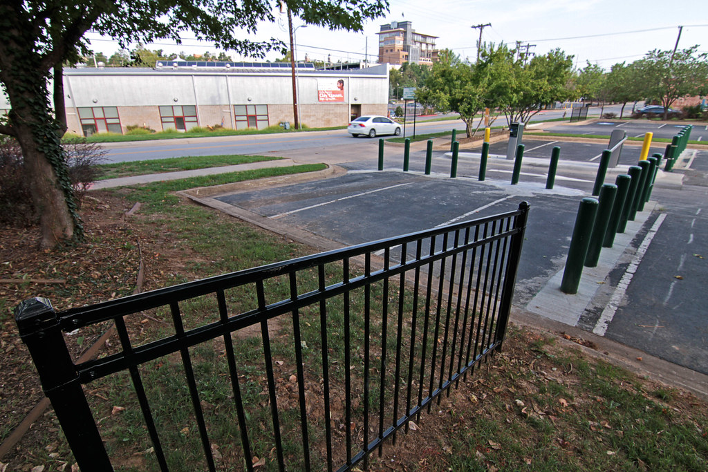 Curb jumping leads to fence installation near paid parking