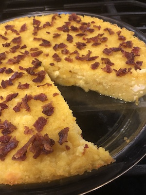 Mamaliga with cheese and crumbled bacon
