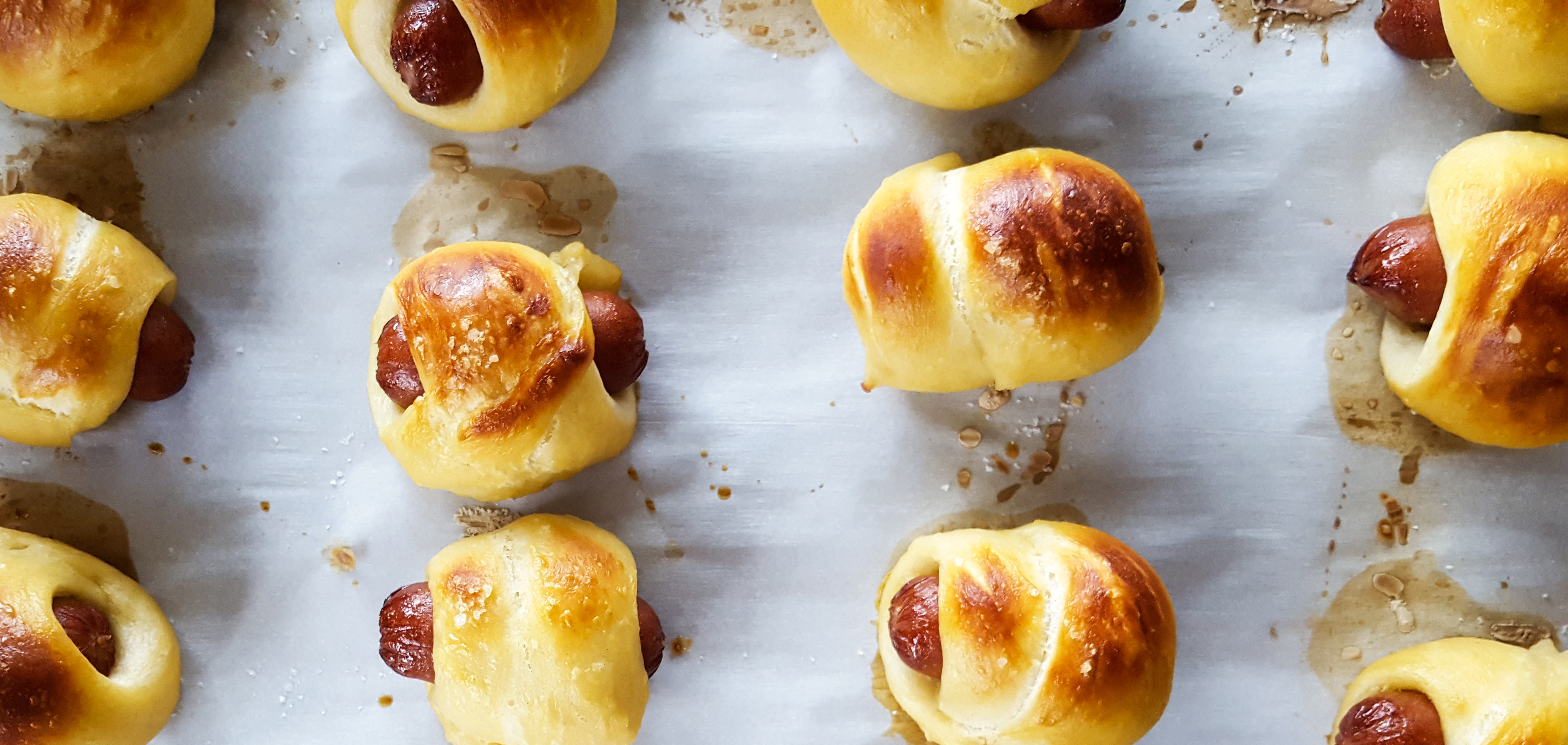 pretzel pastry pigs with hard cider cheddar cheese sauce | super bowl sunday