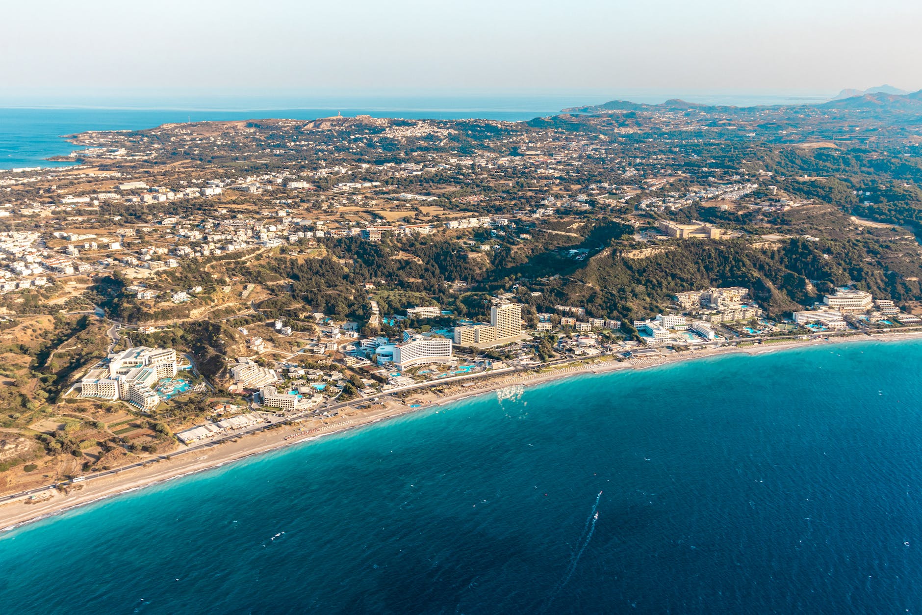 an aerial shot of a coastal city